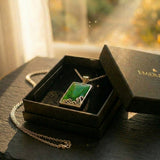 The Holding Stone — rectangular pounamu (greenstone) pendant in silver with carved koru from Aotearoa. A considered NZ-made pounamu keepsake gift for grounding and presence, presented in an EMBER box.