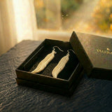 The Featherfall — carved bone feather earrings on sterling silver from Aotearoa, presented ready to gift in an EMBER box. A considered NZ-made keepsake gift for someone who has everything.