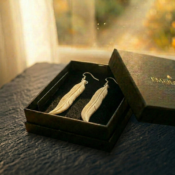 The Featherfall — carved bone feather earrings on sterling silver from Aotearoa, presented ready to gift in an EMBER box. A considered NZ-made keepsake gift for someone who has everything.